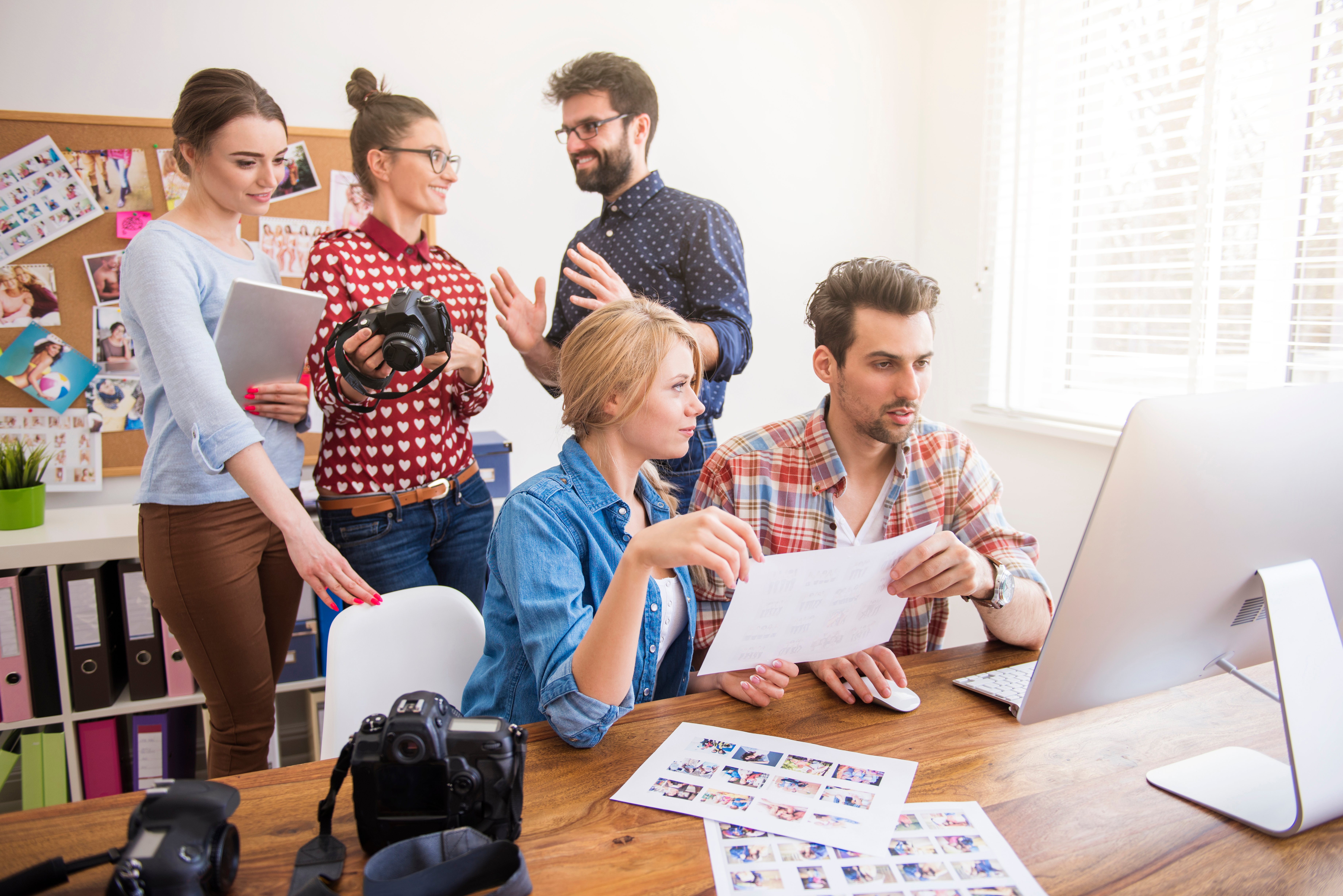 coworkers-office-with-photo-cameras-computer